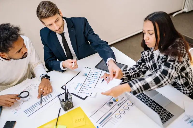 GT Info Services consultants discussing a project plan with a client